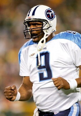 GREEN BAY, WI - OCTOBER 11:  Quarterback Steve McNair #9 of the Tennessee Titans celebrates a touchdown against the Green Bay Packers during the second quarter October 11, 2004 at Lambeau Field in Green Bay, Wisconsin.  (Photo by Matthew Stockman/Getty Im