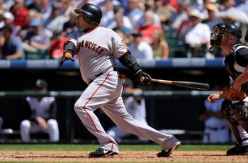 DENVER - MAY 07:  Catcher Benji Molina #1 of the San Francisco Giants follows through on his two run home run off of starting pitcher Jason Marquis of the Colorado Rockies during MLB action at Coors Field on May 7, 2009 in Denver, Colorado. The third inni