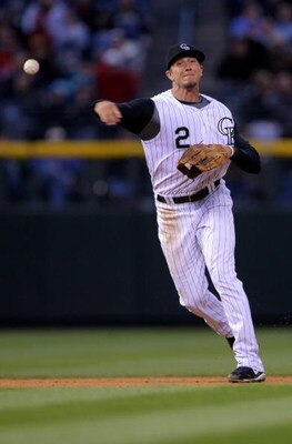 DENVER - APRIL 11:  Shortstop Troy Tulowitzki #2 of the Colorado Rockies makes a defensive play against the Philadelphia Phillies during MLB action at Coors Field on April 11, 2009 in Denver, Colorado. The Phillies defeated the Rockies 8-4.  (Photo by Dou