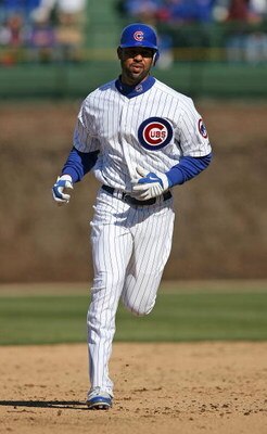 CHICAGO - APRIL 15: Derrek Lee #25 of the Chicago Cubs runs the bases after hitting his first home run of the season in the 9th inning against the Colorado Rockies on April 15, 2009 at Wrigley Field in Chicago, Illinois. The Rockies defeated the Cubs 5-2.