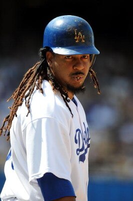 LOS ANGELES, CA - APRIL 19:  Manny Ramirez #99 of the Los Angeles Dodgers on base against the Colorado Rockies during the game at Dodger Stadium on April 19, 2009 in Los Angeles, California.  (Photo by Harry How/Getty Images)