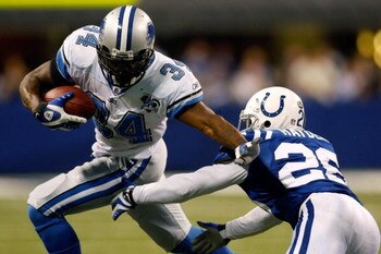 INDIANAPOLIS - DECEMBER 14:  Kevin Smith #34 of the Detroit Lions avoids a tackle by Kelvin Hayden #26 of the Indianapolis Colts on December 14, 2008 at Lucas Oil Stadium in Indianapolis, Indiana.  The Colts defeated the Lions 31-21.  (Photo by Chris Gray
