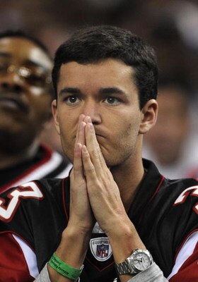 ATLANTA - DECEMBER 14: A fan of the Atlanta Falcons watches play  against the Tampa Bay Buccaneers  at the Georgia Dome on December 14, 2008 in Atlanta, Georgia.  (Photo by Al Messerschmidt/Getty Images)