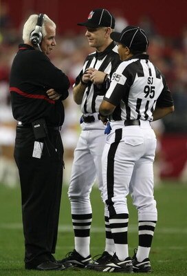 GLENDALE, AZ - JANUARY 03:  Head coach Mike Smith of the Atlanta Falcons talks with refferees during the NFC Wild Card Game against the Arizona Cardinals on January 3, 2009 at University of Phoenix Stadium in Glendale, Arizona.  (Photo by Jed Jacobsohn/Ge