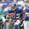 EAST RUTHERFORD, NJ - DECEMBER 7:  Sinorice Moss #83 of the New York Giants carries the ball against the Philadelphia Eagles at Giants Stadium on December 7, 2008 in East Rutherford, New Jersey. (Photo by Nick Laham/Getty Images)