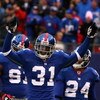 EAST RUTHERFORD, NJ - NOVEMBER 16:  Aaron Ross #31 of the New York Giants celebrates after returning an interception for a touchdown against  the Baltimore Ravens in the fourth quarter of  their game on November 16, 2008 at Giants Stadium in East Rutherfo
