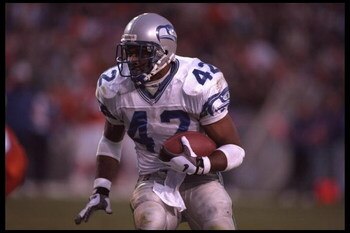 10 Dec 1995:  Running back Chris Warren #42 of the Seattle Seahawks carries his ball into the defense of the Denver Broncos at Mile High Stadium in Denver, Colorado. The Seahawks defeated the Broncos 31-27. Mandatory Credit:  Al Bello/Allsport