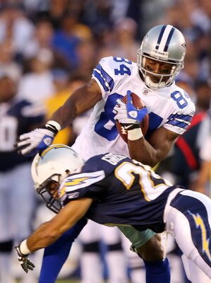 SAN DIEGO - AUGUST 09:   Steve Gregory #28 of the San Diego Chargers tackles Patrick Crayton #84 of the Dallas Cowboys during a pre-season game at Qualcomm Stadium on August 9, 2008 in San Diego, California.  (Photo by Lisa Blumenfeld/Getty Images)