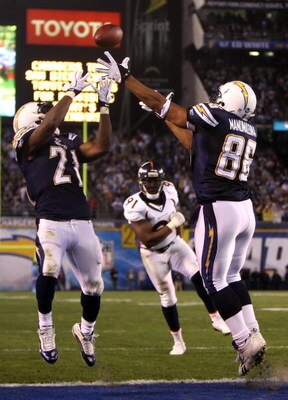 SAN DIEGO - DECEMBER 28:  Tight end Brandon Manumaleuna #86 of the San Diego Chargeover  LaDainian Tomlinson #21 and Ebenezer Ekuban #91 of the Denver Broncos during the second quarter of the NFL game at Qualcomm Stadium on December 28, 2008 in San Diego,