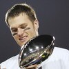 JACKSONVILLE, FLORIDA - FEBRUARY 06:  Quarterback Tom Brady #12 of the New England Patriots celebrates with the Lombardi trophy after defeating the Philadelphia Eagles in Super Bowl XXXIX at Alltel Stadium on February 6, 2005 in Jacksonville, Florida.  Th