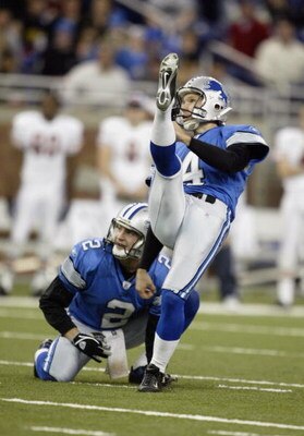 DETROIT - NOVEMBER 9:  Kicker Jason Hanson #4 and place holder Nick Harris #2 of the Detroit Lions watch Hanson's field goal attempt during the game against the Chicago Bears on November 9, 2003 at Ford Field in Detroit, Michigan. The Lions defeated the B