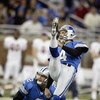 DETROIT - NOVEMBER 9:  Kicker Jason Hanson #4 and place holder Nick Harris #2 of the Detroit Lions watch Hanson's field goal attempt during the game against the Chicago Bears on November 9, 2003 at Ford Field in Detroit, Michigan. The Lions defeated the B