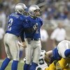 DETROIT, MI - NOVEMBER 27:  Nick Harris #2 of the Detroit Lions congratulates teammate, Jason Hanson #4 after a field goal against the Green Bay Packers on November 27, 2003 at Ford Field in Detroit, Michigan. The Lions won the game, 22-14. (Photo by Tom 