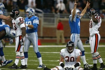 DETROIT - OCTOBER 20:  Place kicker Jason Hanson #4 of the Detroit Lions celebrates after kicking the game winning field goal in overtime as Mike Brown #30 and Roosevelt Williams #20 of the Chicago Bears react, stunned, during the NFL game at Ford Field i