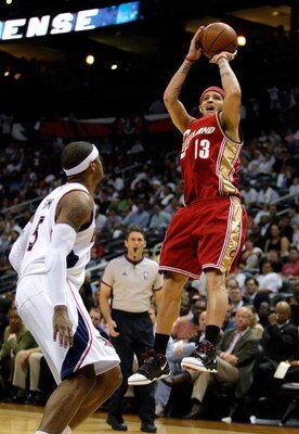 ATLANTA - MAY 11:  Delonte West #13 of the Cleveland Cavaliers shoots over Josh Smith #5 of the Atlanta Hawks during Game Four of the Eastern Conference Semifinals during the 2009 NBA Playoffs at Philips Arena on May 11, 2009 in Atlanta, Georgia.  NOTE TO