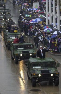 30 Jan 2001:  Super Bowl XXXV champions Baltimore Ravens travel in Hummer's down Pratt Street along the Inner Harbor during their victory parade through the rain soaked streets of downtown Baltimore, Maryland. Digital File Mandatory Credit: Doug Pensinger