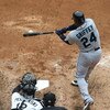 CHICAGO - APRIL 29: Ken Griffey, Jr. #24 of the Seattle Mariners hits the ball as catcher A.J. Pierzynski #12 of the Chicago White Sox awaits the ball on April 29, 2009 at U.S. Cellular Field in Chicago, Illinois. The White Sox defeated the Mariners 6-3. 