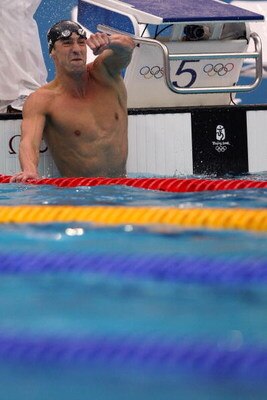 BEIJING - AUGUST 16:  Michael Phelps of the United States celebrates victory in the Men's 100m Butterfly Final held at the National Aquatics Centre during Day 8 of the Beijing 2008 Olympic Games on August 16, 2008 in Beijing, China. By winning gold in the