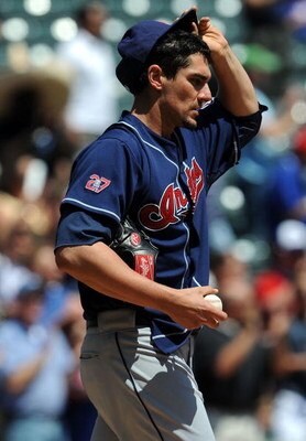 ARLINGTON, TX - APRIL 09:  Pitcher Carl Pavano #9 of the Cleveland Indians reacts after giving up a two-run homerun against the Texas Rangers in the second inning on April 9, 2009 at Rangers Ballpark in Arlington, Texas.  (Photo by Ronald Martinez/Getty I