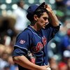ARLINGTON, TX - APRIL 09:  Pitcher Carl Pavano #9 of the Cleveland Indians reacts after giving up a two-run homerun against the Texas Rangers in the second inning on April 9, 2009 at Rangers Ballpark in Arlington, Texas.  (Photo by Ronald Martinez/Getty I