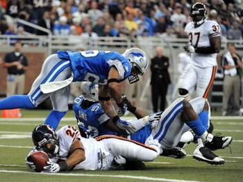 DETROIT - OCTOBER 05:  Matt Forte #22 of the Chicago Bears is awarded a touhdown as he appears to have been stopped by Dwight Smith #26 and Ernie Sims #50 of the Detroit Lions on the goaline for a 10-0 lead during the aecond quarter at Ford Field on Octob