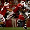 MADISON, WI - OCTOBER 04:  Quarterback Terrelle Pryor #2 of the Ohio State Buckeyes is sacked by Mike Newkirk #54 and DeAndre Levy #11 of the Wisconsin Badgers at Camp Randall Stadium  October 4, 2008 in Madison, Wisconsin.  (Photo by Matthew Stockman/Get
