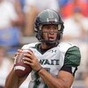 GAINESVILLE, FL - AUGUST 30:  Quarterback Kawika Funaki #11 of the Hawaii Warriors looks to pass the ball during the game against the Florida Gators at Ben Hill Griffin Stadium on August 30, 2008 in Gainesville, Florida.  (Photo by Sam Greenwood/Getty Ima