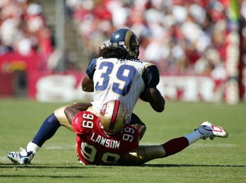 SAN FRANCISCO - SEPTEMBER 17:  Running back Steven Jackson #39 of the St Louis Rams is tackled by linebacker Manny Lawson #99 of the San Francisco 49ers during an NFL game at Monster Park on September 17, 2006 in San Francisco, California.  (Photo by Jed 