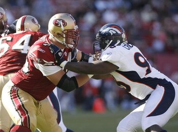 SAN FRANCISCO - AUGUST 13:  Offensive lineman Joe Staley of the San Francisco 49ers battles defensive lineman Tim Crowder of the Denver Broncos on August 13, 2007 at Monster Park in San Francisco, California.  (Photo by Greg Trott/Getty Images)