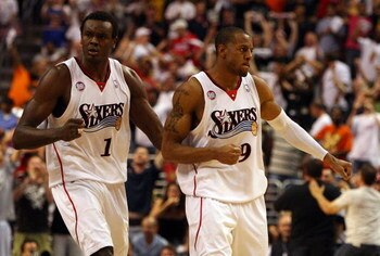 PHILADELPHIA - APRIL 26:  Andre Iguodala #9 and Samuel Dalembert #1 of the Philadelphia 76ers react after a basket against the Orlando Magic during Game Four of the Eastern Conference Quarterfinals during the 2009 NBA Playoffs at the Wachovia Center on Ap