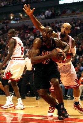 CHICAGO - DECEMBER 02:  Elton Brand #42 of the Philadelphia 76ers drives against Drew Gooden #90 of the Chicago Bulls at the United Center on December 2, 2008 in Chicago, Illinois.  NOTE TO USER: User expressly acknowledges and agrees that, by downloading