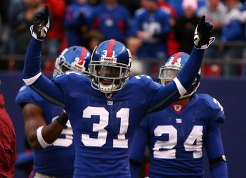 EAST RUTHERFORD, NJ - NOVEMBER 16:  Aaron Ross #31 of the New York Giants celebrates after returning an interception for a touchdown against  the Baltimore Ravens in the fourth quarter of  their game on November 16, 2008 at Giants Stadium in East Rutherfo