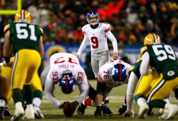 GREEN BAY, WI - JANUARY 20:  Kicker Lawrence Tynes #9 of the New York Giants prepares to kick the game winning 47 yard field goal to win the NFC championship game against the Green Bay Packers on January 20, 2008 at Lambeau Field in Green Bay, Wisconsin. 