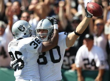 OAKLAND, CA - SEPTEMBER 28:   Zach Miller #80 of the Oakland Raiders celebrates with Justin Griffith #36 after scoring a touchdown against the San Diego Chargers during an NFL game on September 28, 2008 at McAfee Coliseum in Oakland, California.  (Photo b