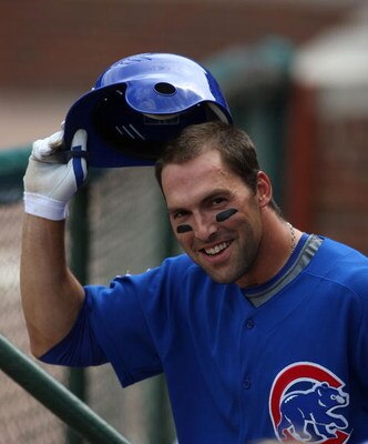 CHICAGO - AUGUST 06: Mark DeRosa #7 of the Chicago Cubs tips his hat to the crowd after hitting a grand slam home run in the 3rd inning against the Houston Astros on August 6, 2008 at Wrigley Field in Chicago, Illinois. (Photo by Jonathan Daniel/Getty Ima