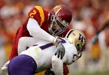 LOS ANGELES, CA - NOVEMBER 01: Safety Taylor Mays #2 of the USC Trojans tackles running back Terrance Dailey #27 of the Washington Huskies on November 1, 2008 at the Los Angeles Coliseum in Los Angeles, California. USC won 56-0.  (Photo by Stephen Dunn/Ge