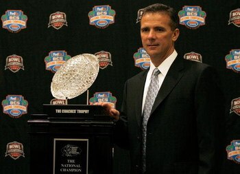 FORT LAUDERDALE, FL - JANUARY 07: Head coach Urban Meyer of the Florida Gators poses with the 'The Coaches' Trophy' during the FedEx BCS Head Coaches Press Conference at Harbor Beach Marriott Resort & Spa on January 7, 2009 in Fort Lauderdale, Florida.