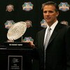 FORT LAUDERDALE, FL - JANUARY 07:  Head coach Urban Meyer of the Florida Gators poses with the 'The Coaches' Trophy' during the FedEx BCS Head Coaches Press Conference at Harbor Beach Marriott Resort & Spa on January 7, 2009 in Fort Lauderdale, Florida.  