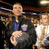 MIAMI - JANUARY 08:  Head coach Urban Meyer of the Florida Gators walks off with the National Championship trophy after their 24-14 win against the Oklahoma Sooners during the FedEx BCS National Championship game at Dolphin Stadium on January 8, 2009 in M