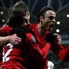 BOLTON, UNITED KINGDOM - JANUARY 17:  Dimitar Berbatov (R) of Manchester United celebrates with team mates Carlos Tevez and Michael Carrick after scoring in the final minutes during the Barclays Premier League match between Bolton Wanderers and Manchester