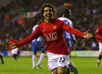 WIGAN, ENGLAND - MAY 13:  Carlos Tevez of Manchester United celebrates after scoring the equalizing goal during the Barclays Premier League match between Wigan Athletic and Manchester United at the JJB Stadium on May 13, 2009 in Wigan, England.  (Photo by