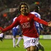WIGAN, ENGLAND - MAY 13:  Carlos Tevez of Manchester United celebrates after scoring the equalizing goal during the Barclays Premier League match between Wigan Athletic and Manchester United at the JJB Stadium on May 13, 2009 in Wigan, England.  (Photo by