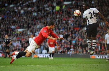 MANCHESTER, ENGLAND - APRIL 25:  Cristiano Ronaldo of Manchester United scores his team's third goal during the Barclays Premier League match between Manchester United and Tottenham Hotspur at Old Trafford on April 25, 2009 in Manchester, England.  (Photo