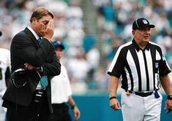 JACKSONVILLE, FL - SEPTEMBER 9:  Head coach Jack Del Rio of the Jacksonville Jaguars hangs his head after a conversation with field judge Bill Lovett #98 while taking on the Tennessee Titans at Alltel Stadium September 9, 2007 in Jacksonville, Florida.  (