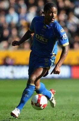 HULL, ENGLAND - APRIL 04:  Glen Johnson of Portsmouth runs with the ball during the Barclays Premier League match between Hull City and Portsmouth at the KC Stadium on April 4, 2009 in Hull, England.  (Photo by Clive Rose/Getty Images)