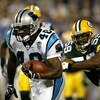 CHARLOTTE, NC - SEPTEMBER 13:  Steven Davis #48 of the Carolina Panthers runs the ball past Mike Flanagan #58 of the Green Bay Packers September 13, 2004 at Bank of America Stadium in Charlotte, North Carolina. (Photo by Streeter Lecka/Getty Images)