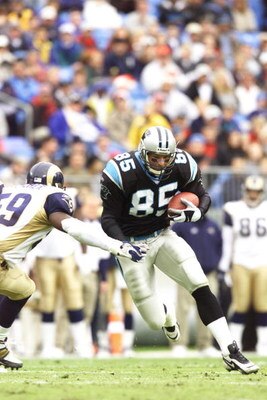 23 Dec 2001 : Wesley Walls #85 of the Carolina Panthers tries to get by London Fletcher of the St.Louis Rams during the game at Ericsson Stadium in Charlotte, North Carolina. The Rams won 38-32. DIGITAL IMAGE. Mandatory Credit: Craig Jones/Getty Images