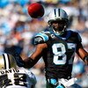 CHARLOTTE, NC - OCTOBER 19:  Jason David #42 of the New Orleans Saints watches as receiver Muhsin Muhammad #87 of the Carolina Panthers tips this pass into his own hands for a reception during the game at Bank of America Stadium on October 19, 2008 in Cha