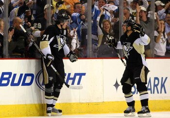 PITTSBURGH - MAY 18:  Evgeni Malkin #71 of the Pittsburgh Penguins celebrates his goal with Tyler Kennedy #48 against the Carolina Hurricanes during Game One of the Eastern Conference Championship Round of the 2009 Stanley Cup Playoffs on May 18, 2009 at 
