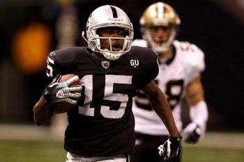 NEW ORLEANS - OCTOBER 12:   Johnnie Lee Higgins #15 of the Oakland Raiders runs past Scott Shanle #58 of the New Orleans Saints on October 12, 2008 at the Superdome in New Orleans, Louisiana.  (Photo by Chris Graythen/Getty Images)